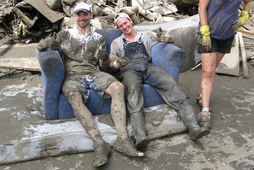 The clean-up crew take a well-deserved break at Sandford Street, St Lucia on January 16, 2011.