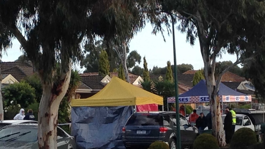 Emergency service tents block a suburban street in Roxburgh Park.