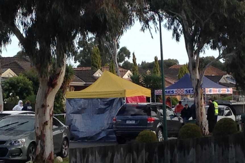 Emergency service tents block a suburban street in Roxburgh Park.