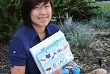 Cherie Chan with the book showing the method used