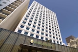 A picture of the white exterior of the InterContinental hotel in Perth against a blue sky.