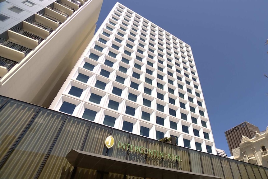 A picture of the white exterior of the InterContinental hotel in Perth against a blue sky.