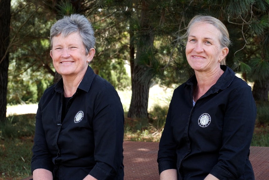 Photo of two smiling women.