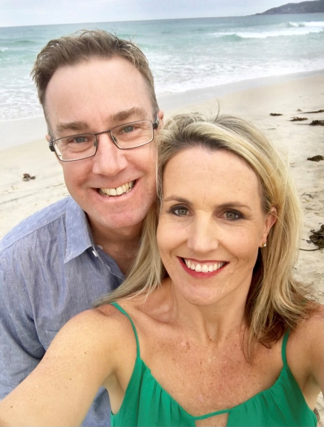 A selfie of Tara Castle with her late husband on a beach.