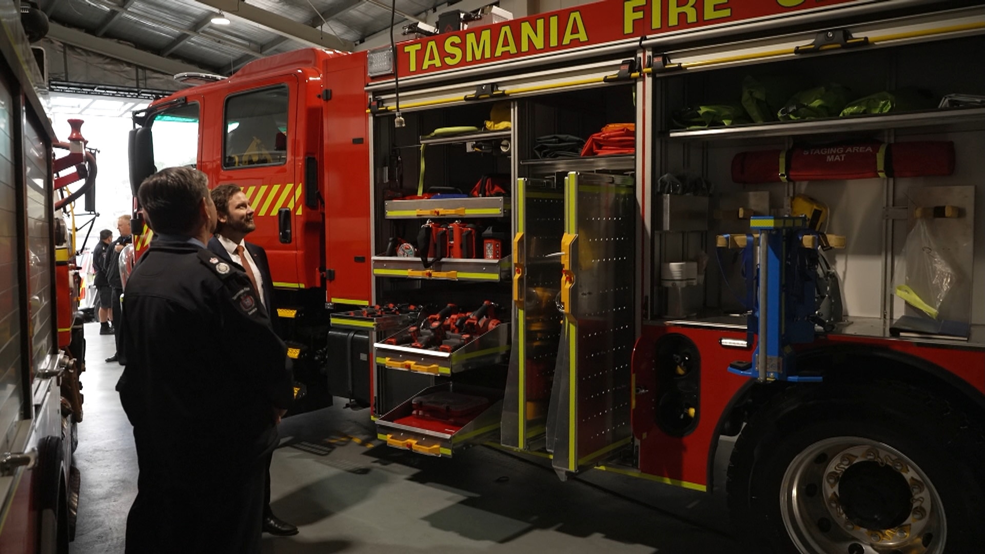 new Tasmanian fire truck in shed being inspected