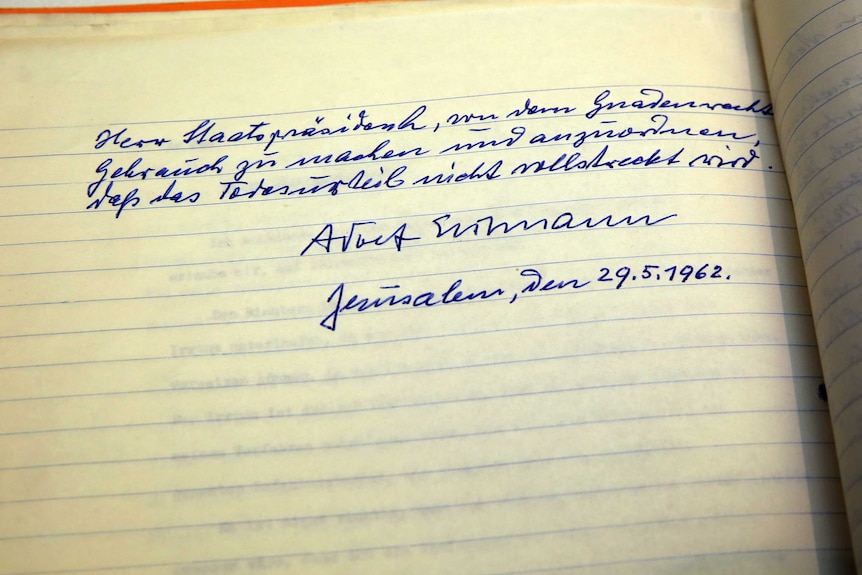 A yellowing piece of paper shows scrawled German handwriting of Adolf Eichmann's clemency plea