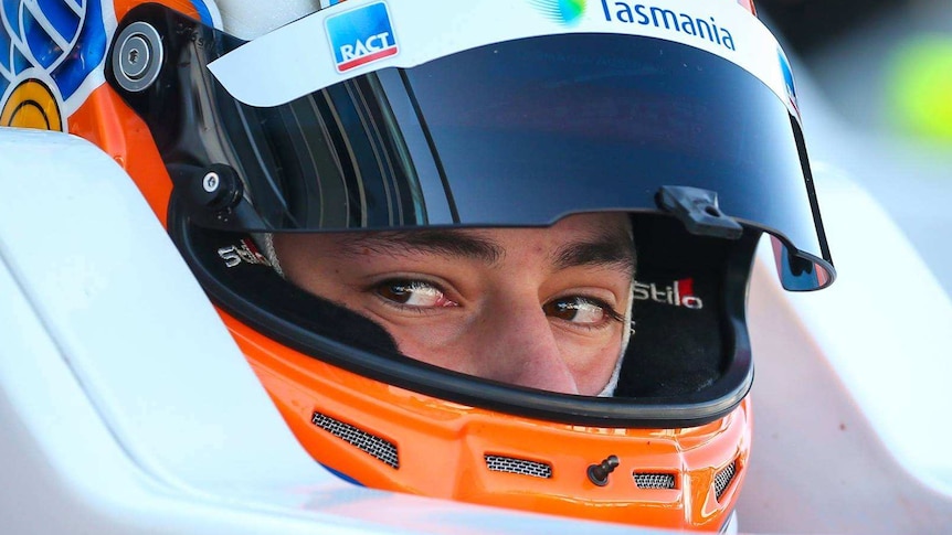 Close up of Tasmanian race car driver Alex Peroni in helmet.