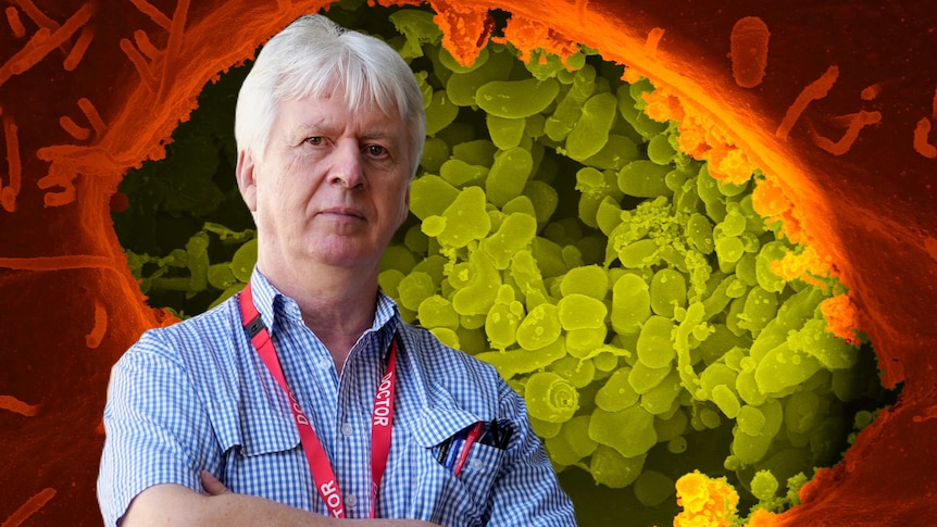 A doctor with his arms folded superimposed in front of an image of bacteria