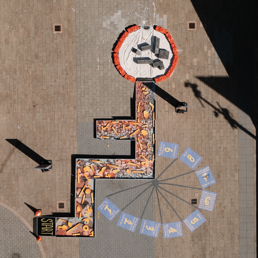 An aerial view of an obstacle course in the shape of a wheelchair symbol