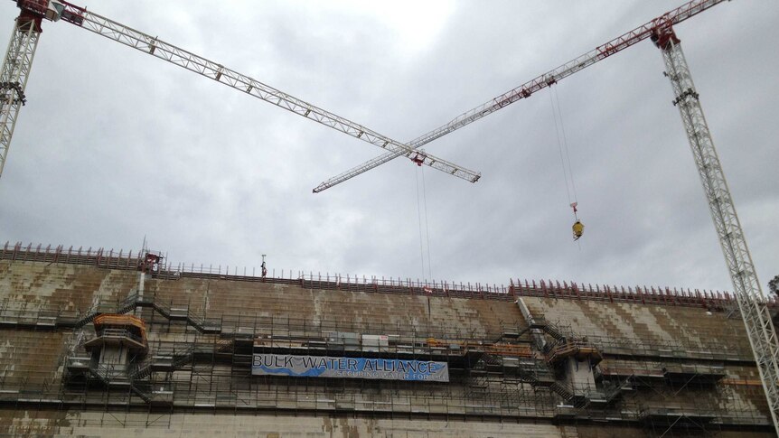 It is over budget and overtime, but this weekend Canberra's Cotter Dam will reach its full height.