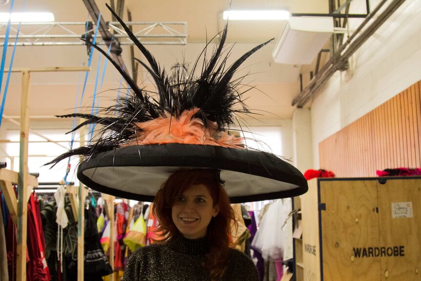 Opera Australia wardrobe coordinator Sara Kolijn wears a chorus hat from the Opera Australia production of My Fair Lady