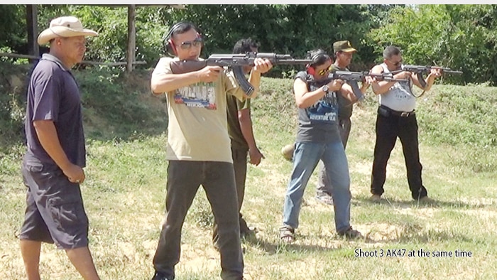 A photo of men fire AK-47s at the Cambodia Firing Range Outdoor Phnom Penh, since removed from the firing range's website.