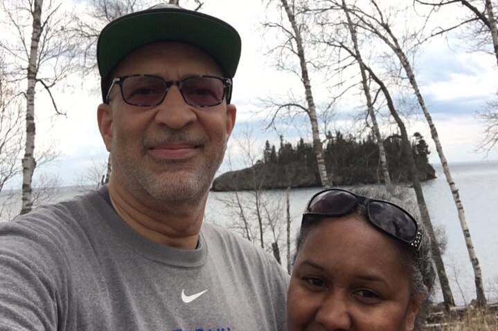 Celester Webb, pastor in St Paul, Minnesota, with his partner outdoors.
