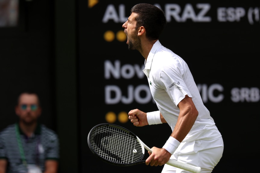 Novak Djokovic yells towards the Wimbledon Centre Court crowd.