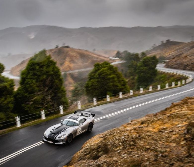 Car on mountain road during Targa Tasmania event.