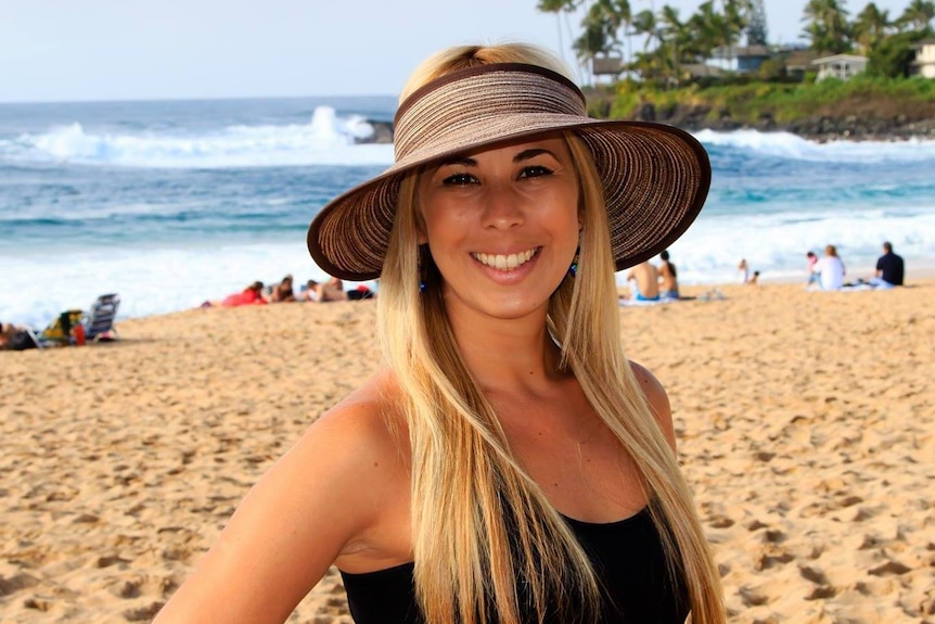 woman wear a sun hat on the beach