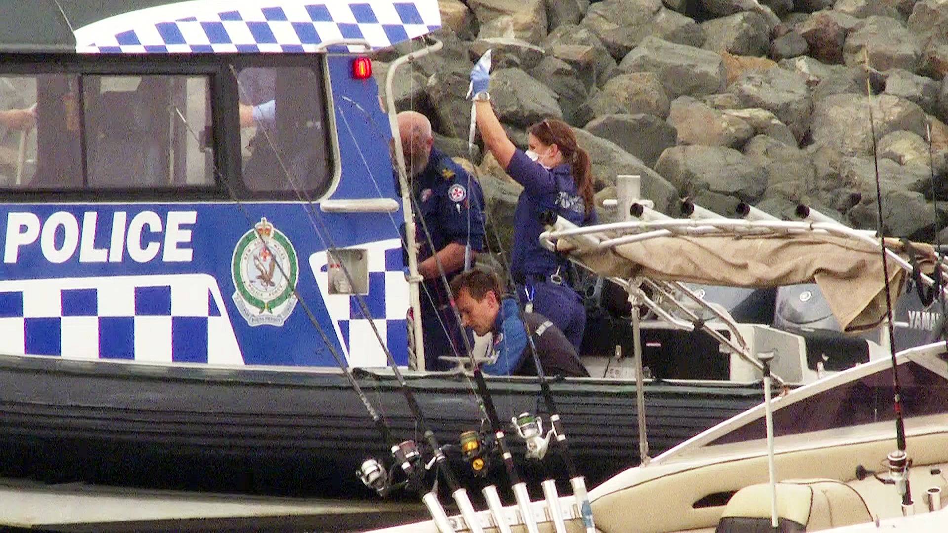 nsw police and paremedics attend to two fishermen whose boat was struck by a whale at la perouse in sydney