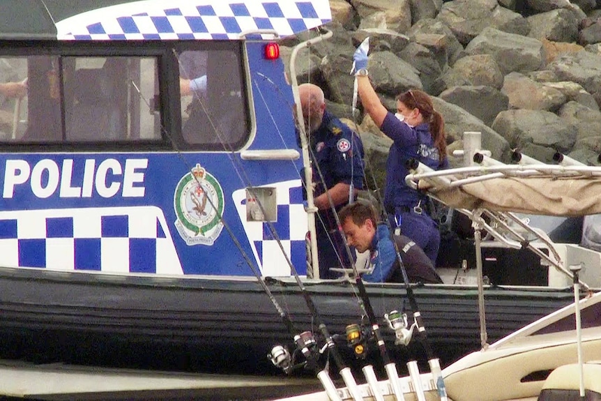 nsw police and paremedics attend to two fishermen whose boat was struck by a whale at la perouse in sydney