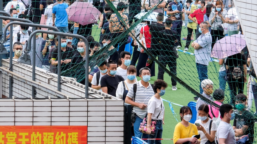 People queue for the mass coronavirus disease (COVID-19) testing in Macau, China June 20, 2022