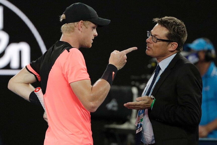 Kyle Edmund points his finger as he speaks with Andreas Egli during his Australian Open semi-final against Marin Cilic.