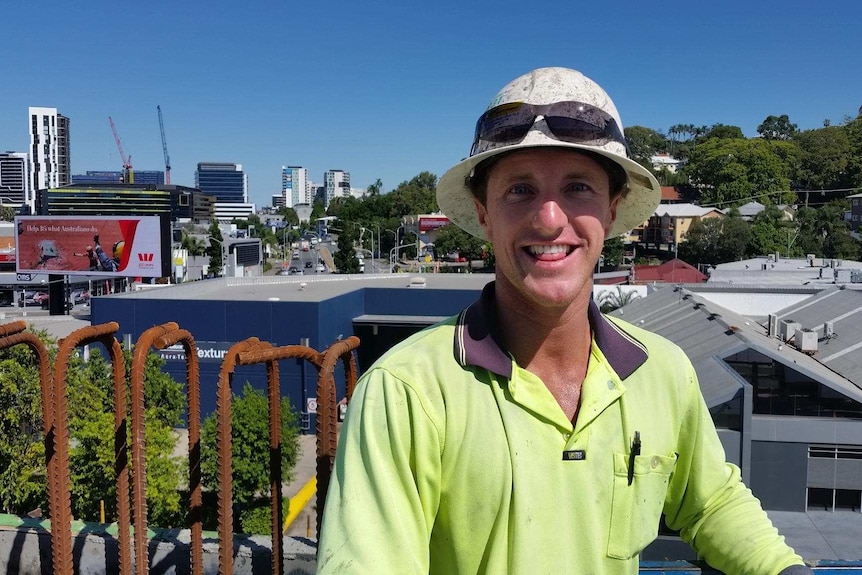 Concreter Dan Cook wearing a hard hat at work depicting someone who takes me time while working to improve their work day.