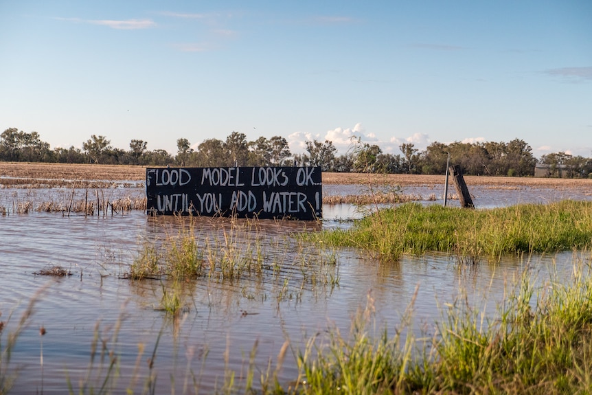 A sign criticizing ARTC flood modeling near the Pampas.