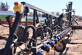 Robotic spray rig stands in paddock.