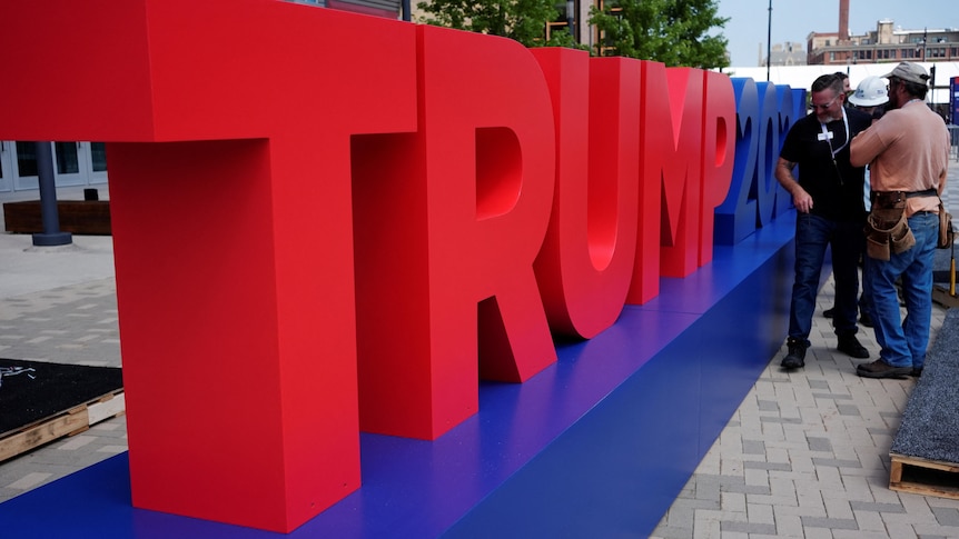 Bright red letters are erected to spell 'Trump'.