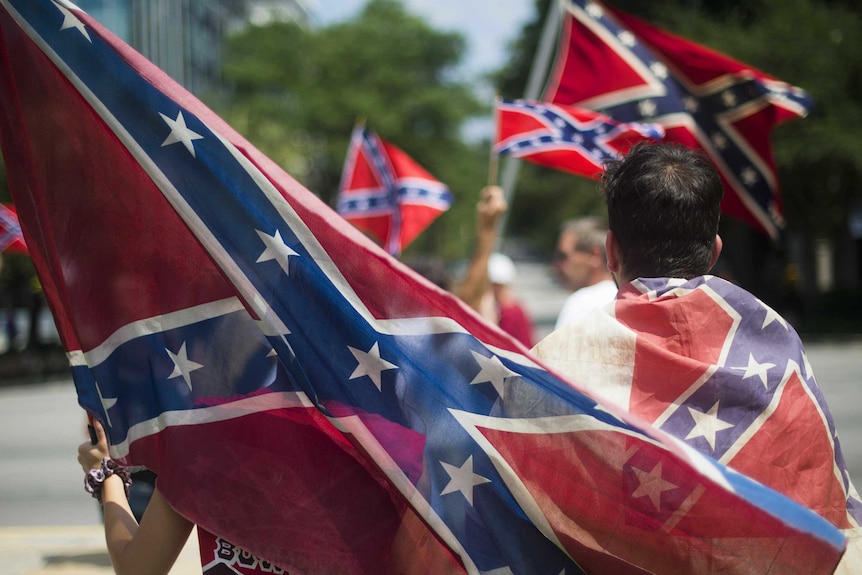 Pro-confederate flag demonstrators march to the South Carolina state house in Columbia 10 days after the Charleston massacre.
