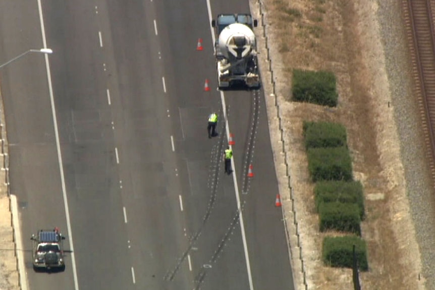 Police close Perth freeway after man hit by truck