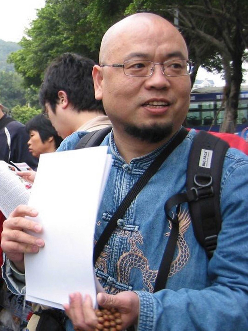 Wu Gan stands outside a court house in southern China.