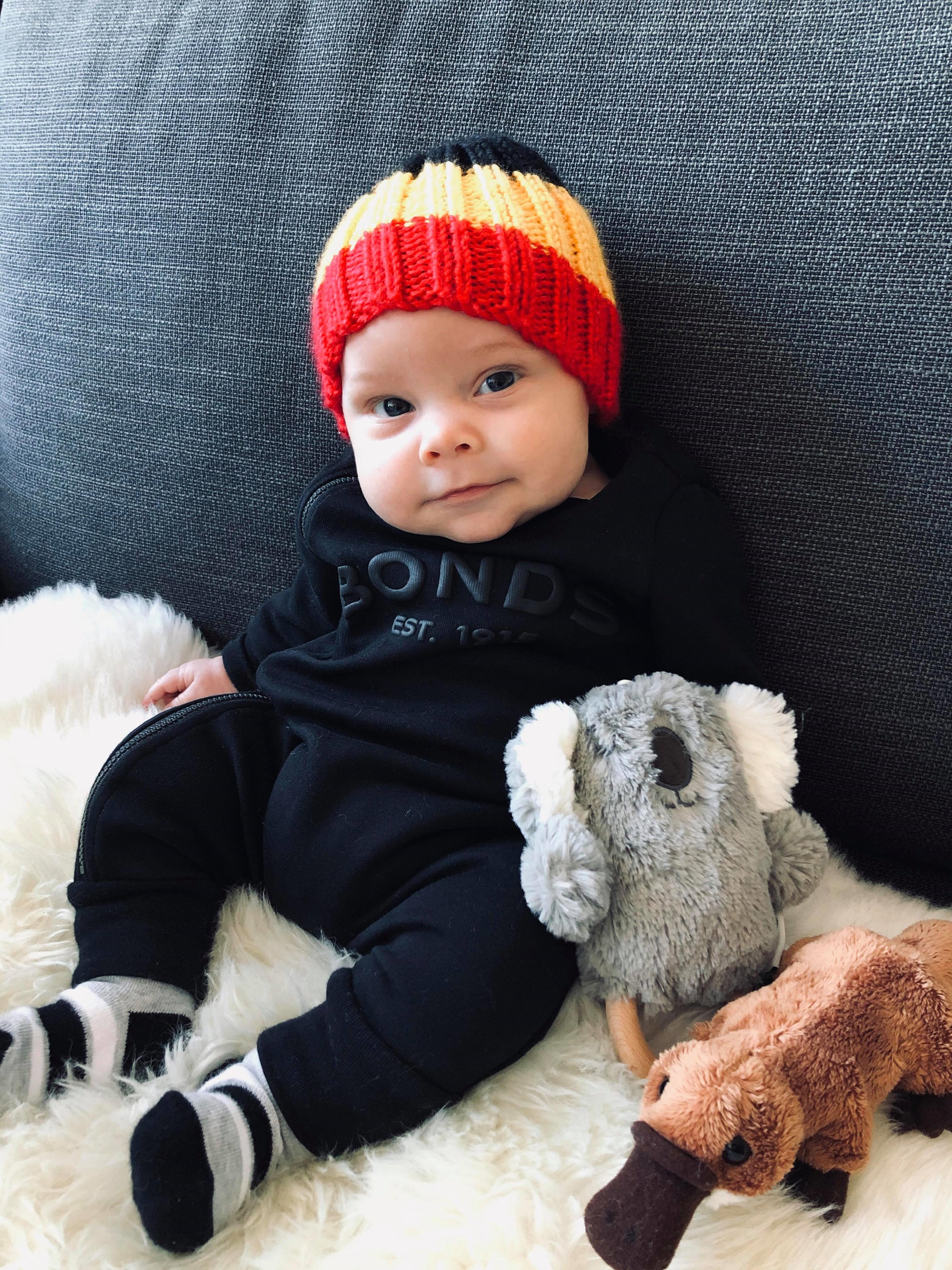 A cute baby with a beany on 