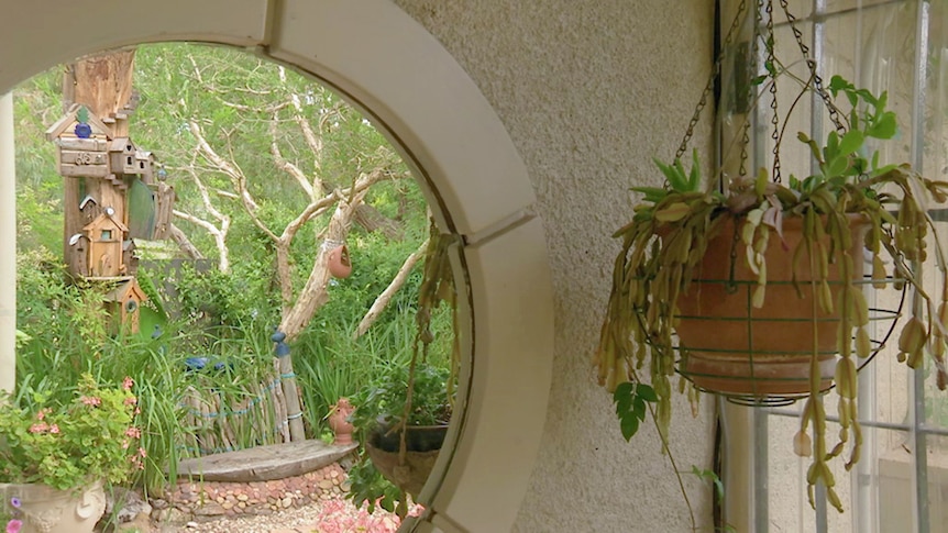 View of garden from inside through round window