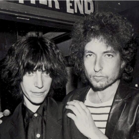 Bob Dylan places his hands on Patti Smith's shoulders