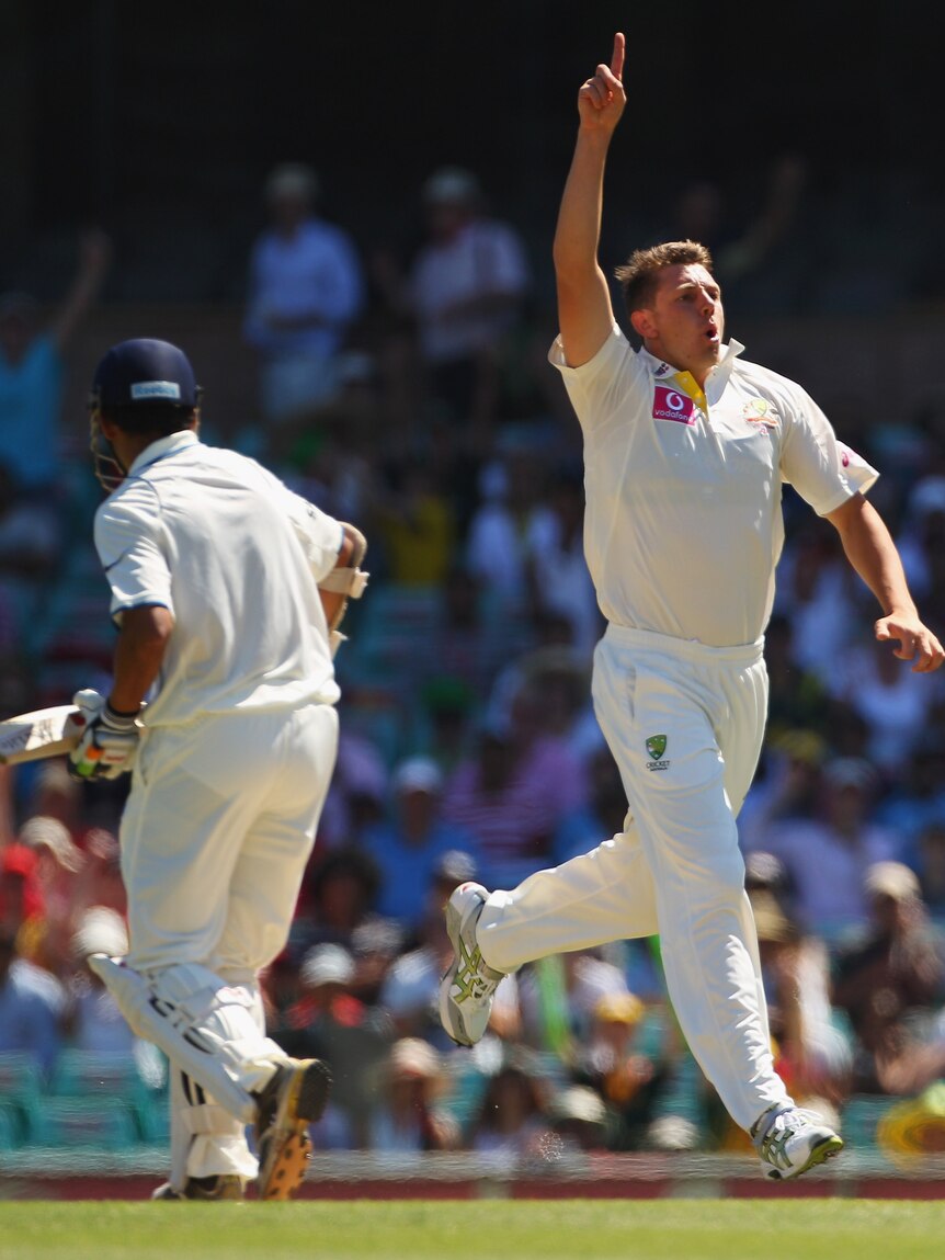 Australia's James Pattinson takes a wicket against India at the SCG in 2012.