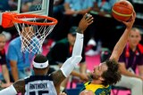 Matt Nielsen (R) goes in for a dunk over Carmelo Anthony of the US during their quarter-final.