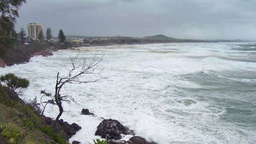 Huge ocean swells from Cyclone Hamish are still making it difficult for the ship to enter the port.