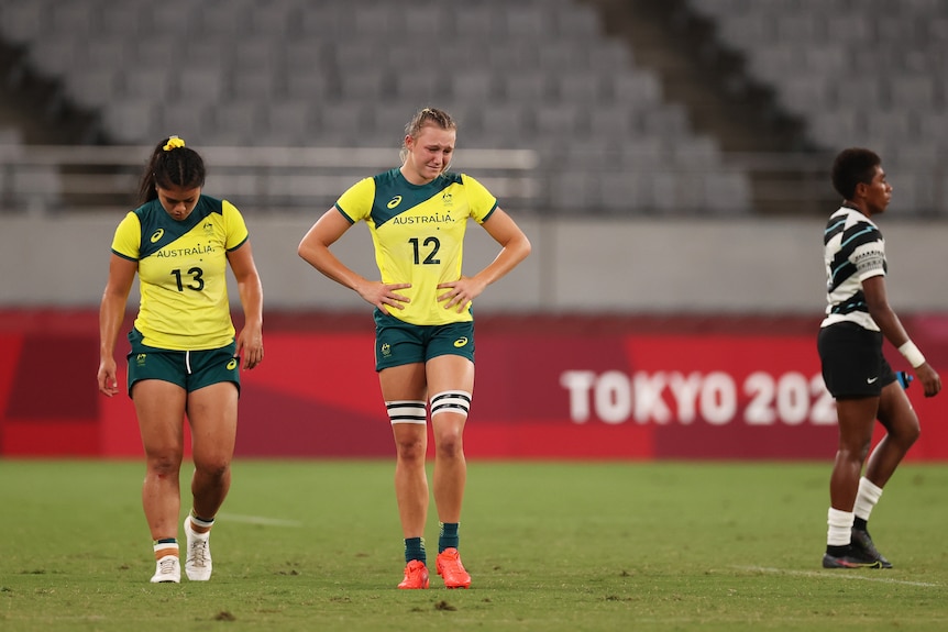 Two Australian women's rugby sevens players are close to tears on the pitch after losing a game at the Olympics. 