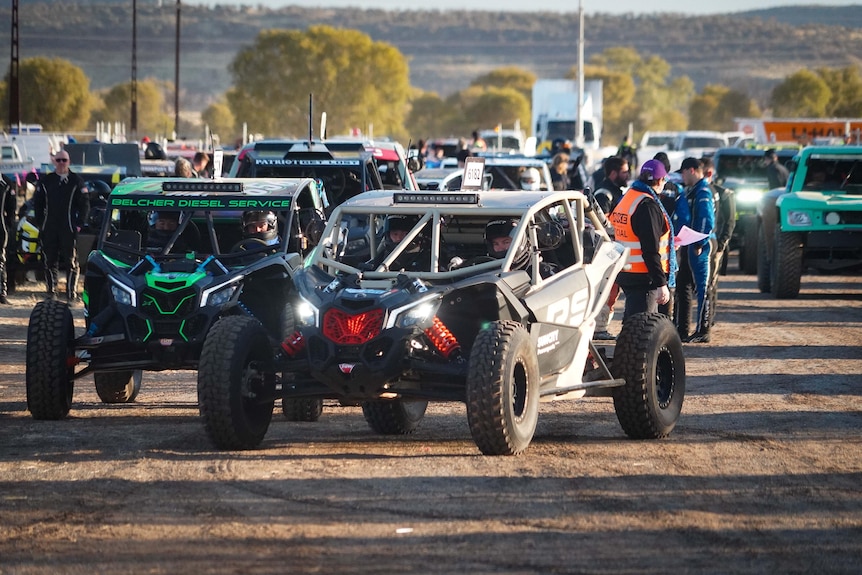 cars lining up at start line of race