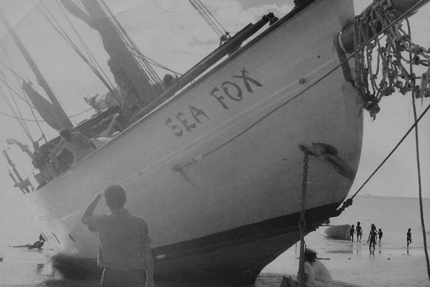 an old photo of a boat shipwrecked on a beach