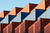 A large stack of shipping containers.