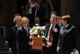 Pallbearers carry the casket of murdered woman Chloe Waterlow