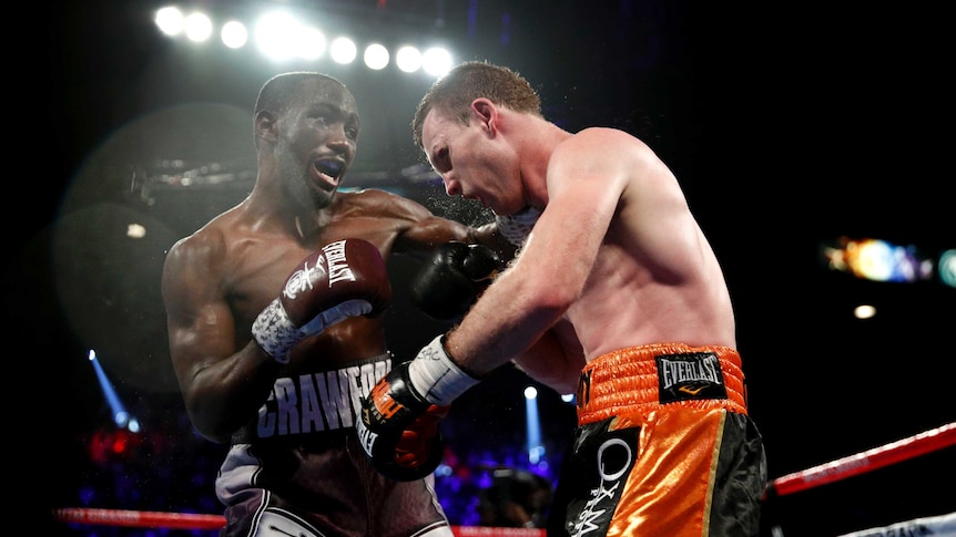 Terence Crawford punches Jeff Horn in their world welterweight boxing title bout in June 2018.