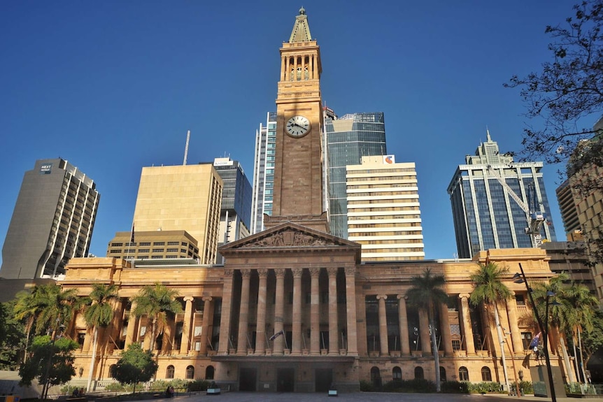 Brisbane's city hall stands among other buildings, pictured from King George Square.