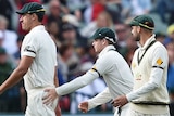 Australia's Mitchell Starc leaves the field with an injury during the third Test at Adelaide Oval.