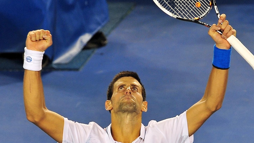 Novak Djokovic celebrates victory over David Ferrer in their quarter-final Australian Open match.