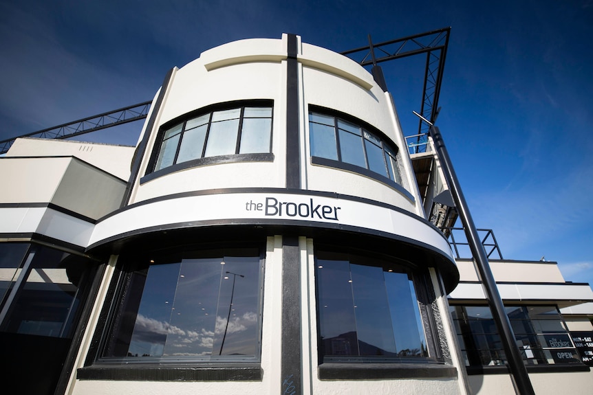 An art deco facade on a hotel called the Brooker Inn