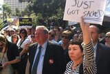 Protesters rally outside Queensland's Parliament House in Brisbane.