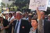 Protesters rally outside Queensland's Parliament House in Brisbane.