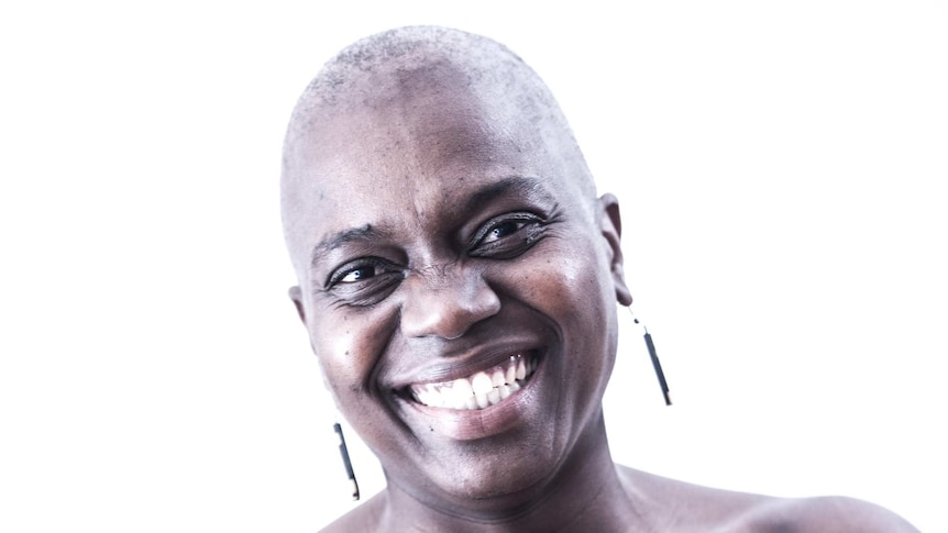 Smiling woman with shaved head